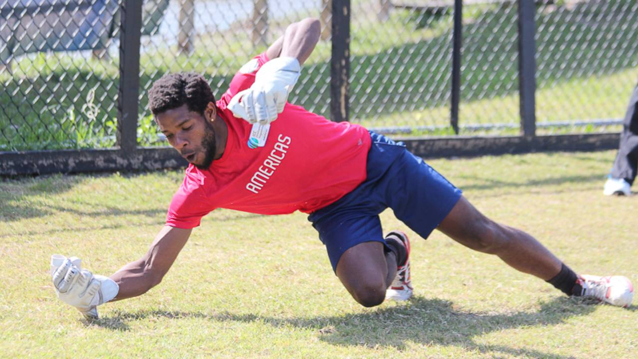 USA wicketkeeper Akeem Dodson shows off his skills during a training session