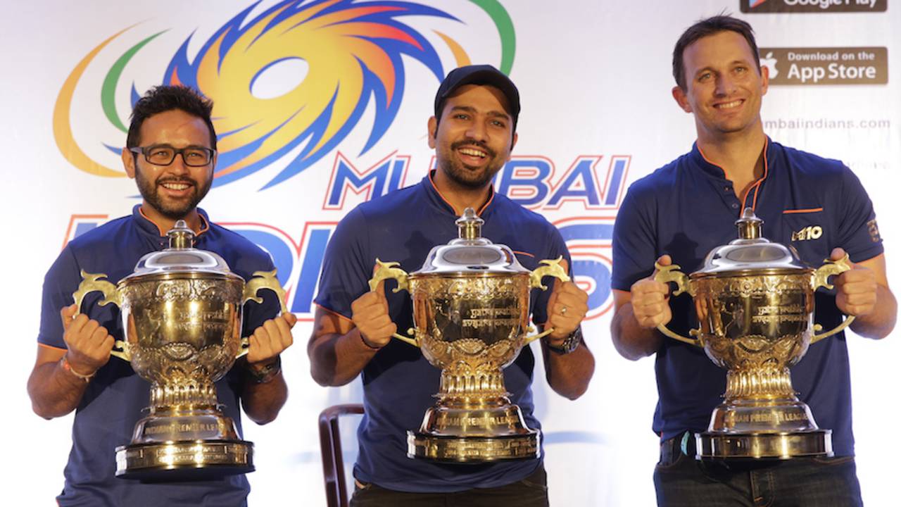 Parthiv Patel, Rohit Sharma and Shane Bond pose with the three IPL trophies&nbsp;&nbsp;&bull;&nbsp;&nbsp;Associated Press