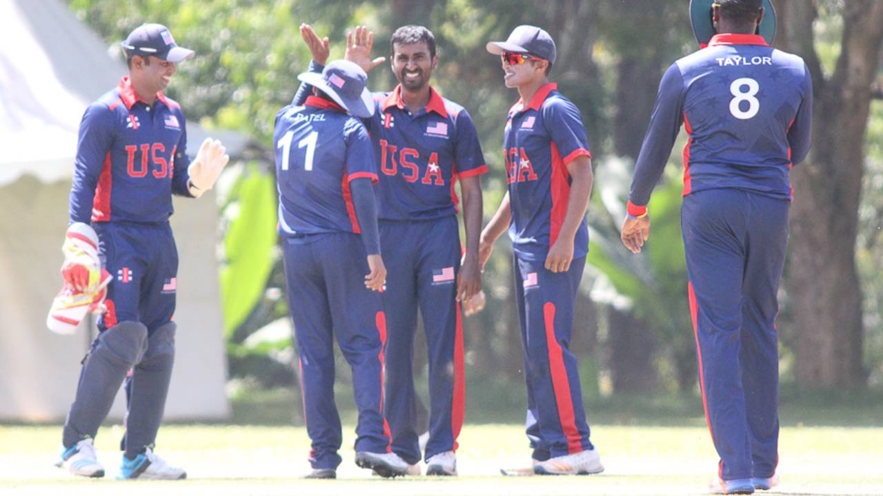 Mrunal Patel gets a high five after bowling Rizwan Cheema, Canada v USA, ICC World Cricket League Division Three, Kampala, May 27, 2017