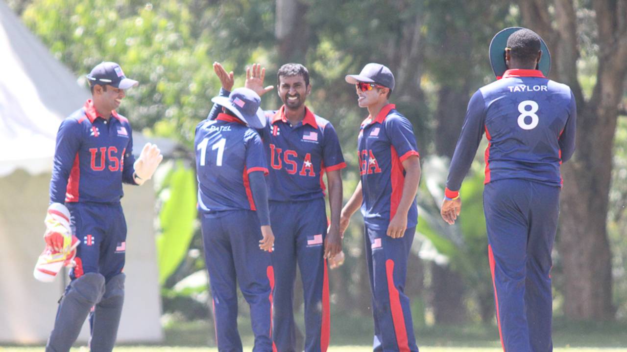 Mrunal Patel gets a high five after bowling Rizwan Cheema, Canada v USA, ICC World Cricket League Division Three, Kampala, May 27, 2017