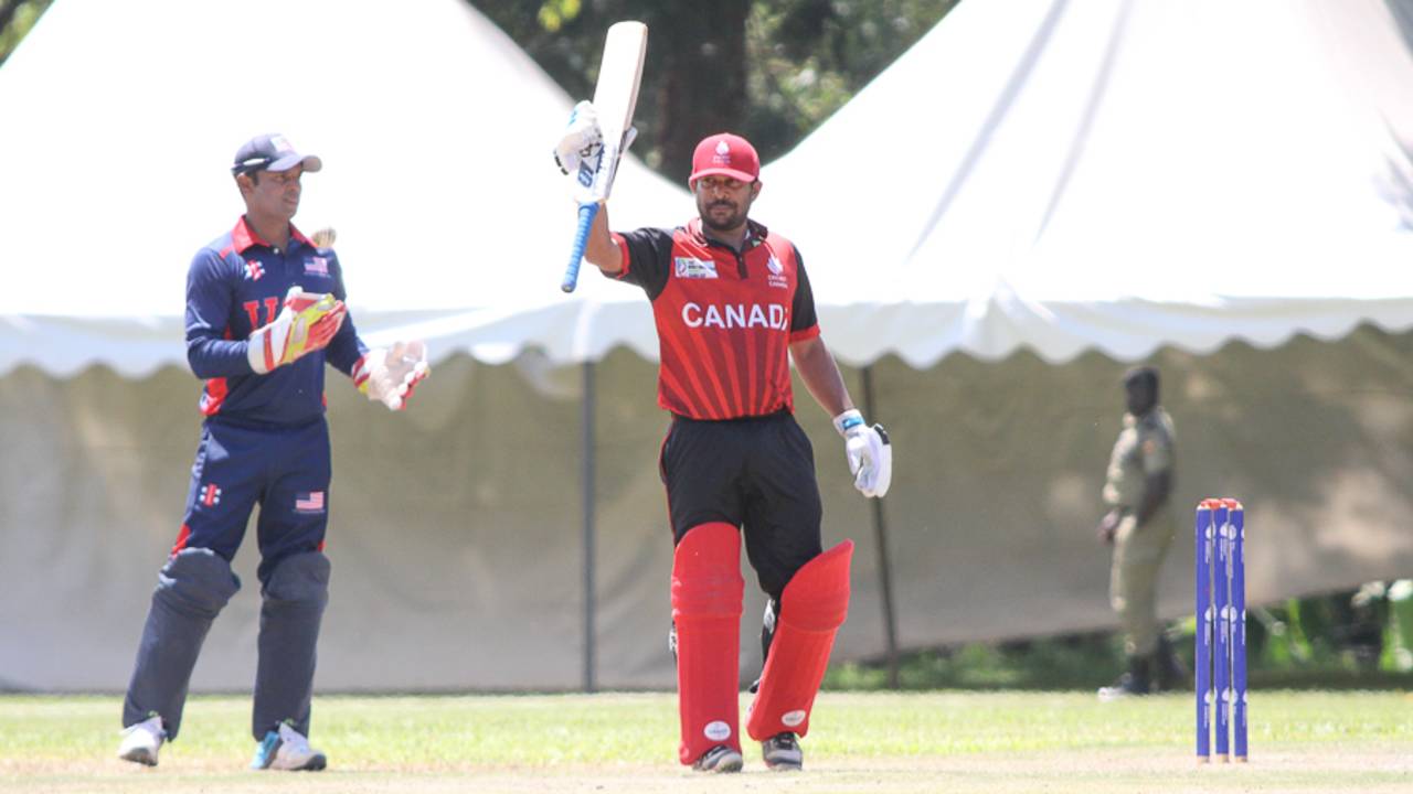 Dhanuka Pathirana raises his bat after reaching a half-century, Canada v USA, ICC World Cricket League Division Three, Kampala, May 27, 2017