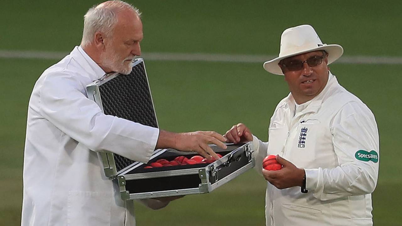 Umpire Neil Bainton selects a new pink ball from the box of replacements, Nottinghamshire v Kent, Specsavers County Championship Division One, Trent Bridge, 1st day, June 26, 2017