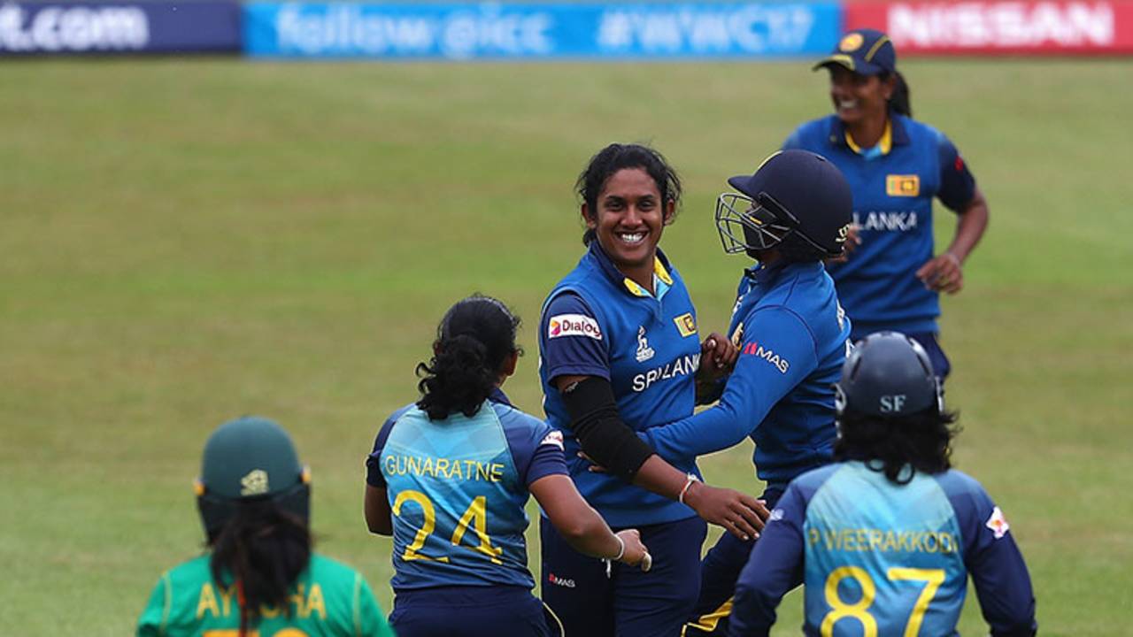 Chandima Gunaratne celebrates with her team-mates after dismissing Ayesha Zafar