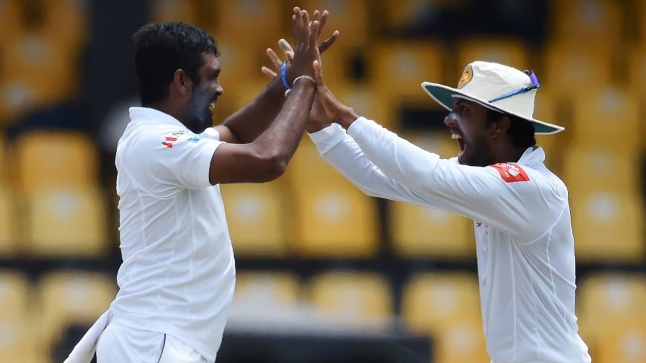 Dilruwan Perera celebrates a wicket with Dinesh Chandimal, Sri Lanka v Zimbabwe, only Test, 3rd day, Colombo, July 16, 2017
