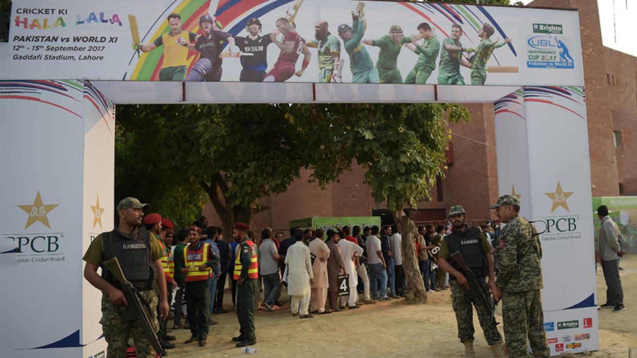 Army soldiers stand guard at the entrance of the venue as spectators queue up to make their way in, Pakistan v World XI, 1st T20I, Independence Cup 2017, Lahore, September 12, 2017