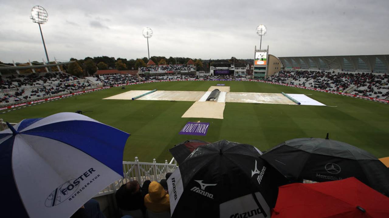 The umbrellas were up as rain interrupted play&nbsp;&nbsp;&bull;&nbsp;&nbsp;Getty Images