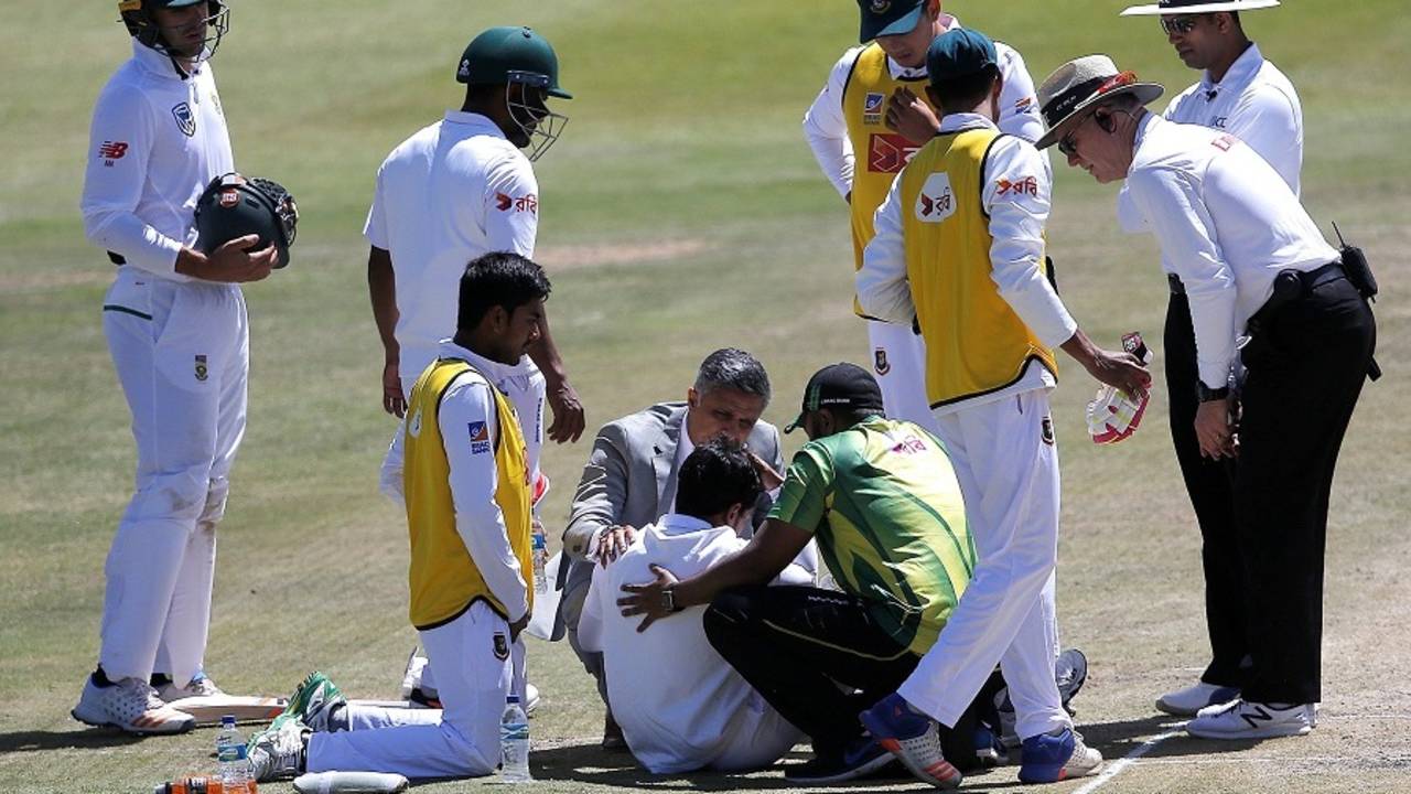 South Africa's team doctor Mohammed Moosajee attends to Mushfiqur Rahim after he is hit on the head, South Africa v Bangladesh, 1st Test, Bloemfontein, 3rd day, October 8, 2017