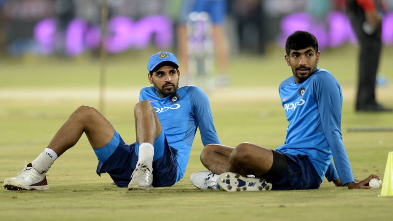 Bhuvneshwar Kumar and Jasprit Bumrah wait for proceedings to begin, India v Australia, 3rd T20I, Hyderabad, October 13, 2017