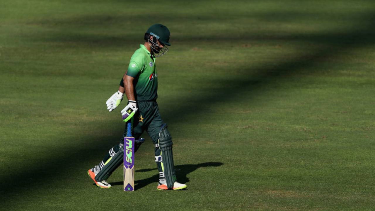 Ahmed Shehzad walks back to the dressing room after being dismissed&nbsp;&nbsp;&bull;&nbsp;&nbsp;Getty Images