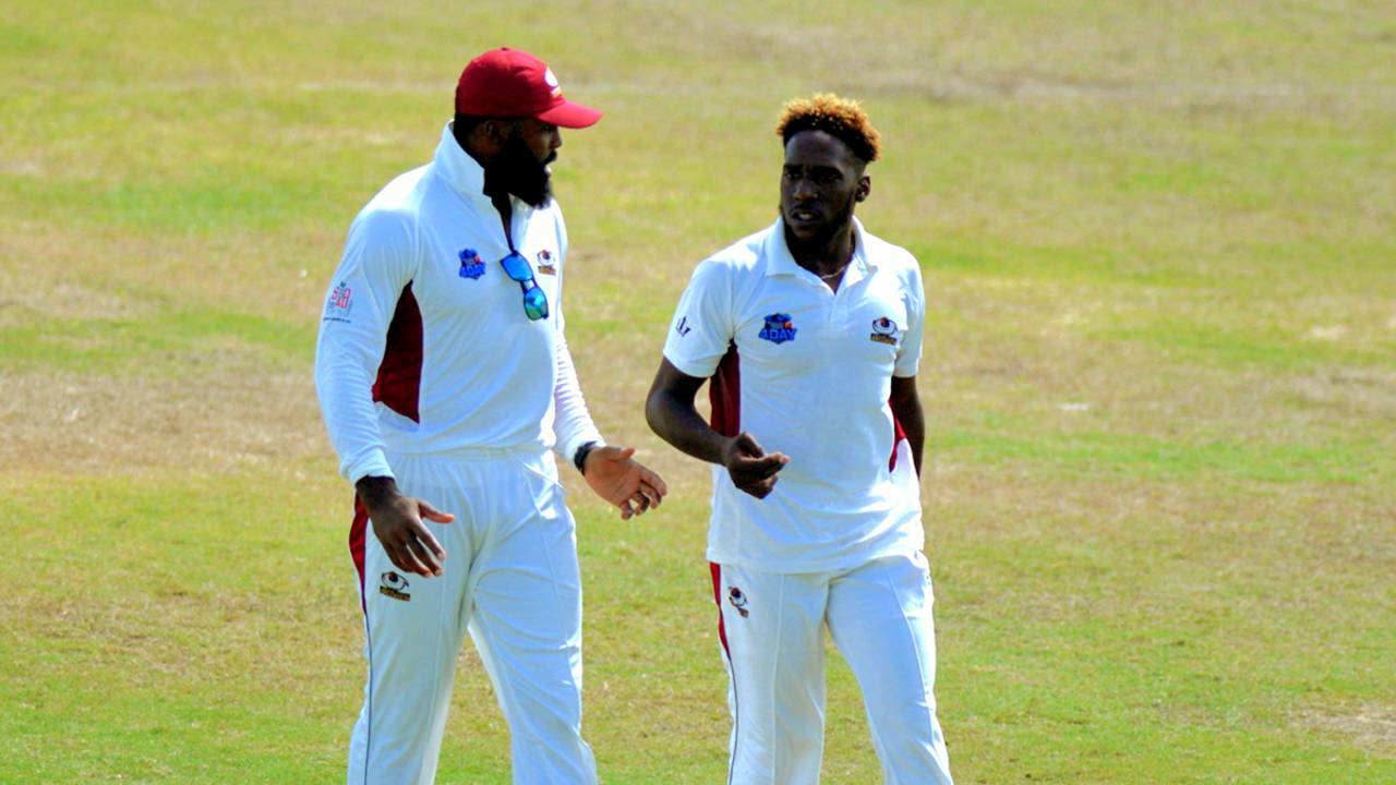 Chesney Hughes chats with Jeremiah Louis, who claimed nine wickets in the game and scored an unbeaten 62