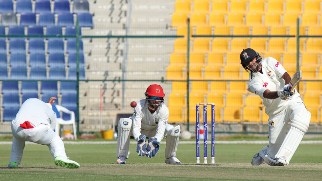 Nasir Jamal takes evasive action as Amjad Javed drives a boundary over cover, UAE v Afghanistan, 2015-17 Intercontinental Cup, 3rd day, Abu Dhabi, December 1, 2017