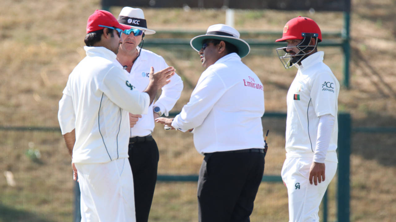 Umpire Ahsan Raza has a word with Afghanistan captain Asghar Stanikzai about his team's behavior, UAE v Afghanistan, 2015-17 Intercontinental Cup, 3rd day, Abu Dhabi, December 1, 2017