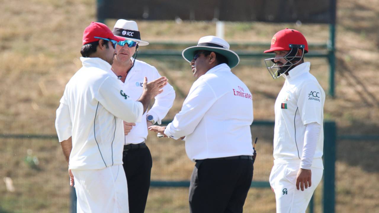 Umpire Ahsan Raza has a word with Afghanistan captain Asghar Stanikzai about his team's behavior, UAE v Afghanistan, 2015-17 Intercontinental Cup, 3rd day, Abu Dhabi, December 1, 2017