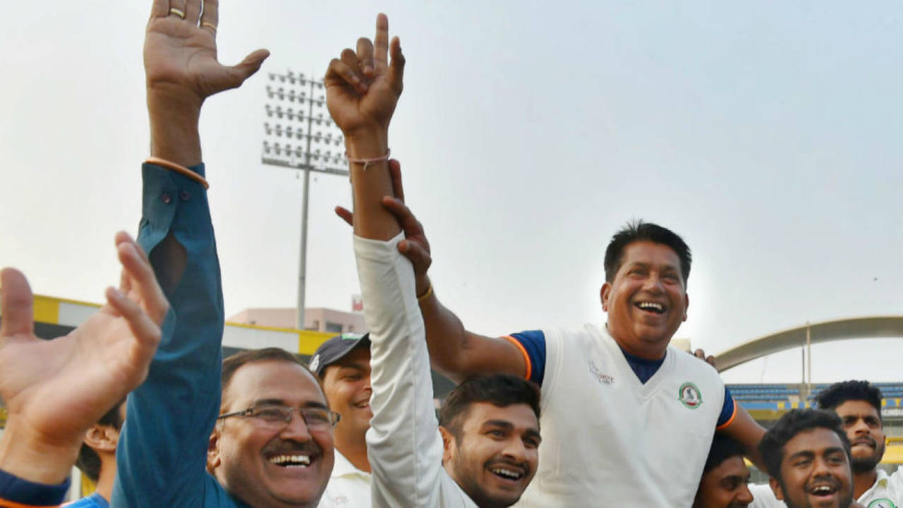 Vidarbha players hoist their head coach Chandrakant Pandit on their shoulders&nbsp;&nbsp;&bull;&nbsp;&nbsp;PTI 