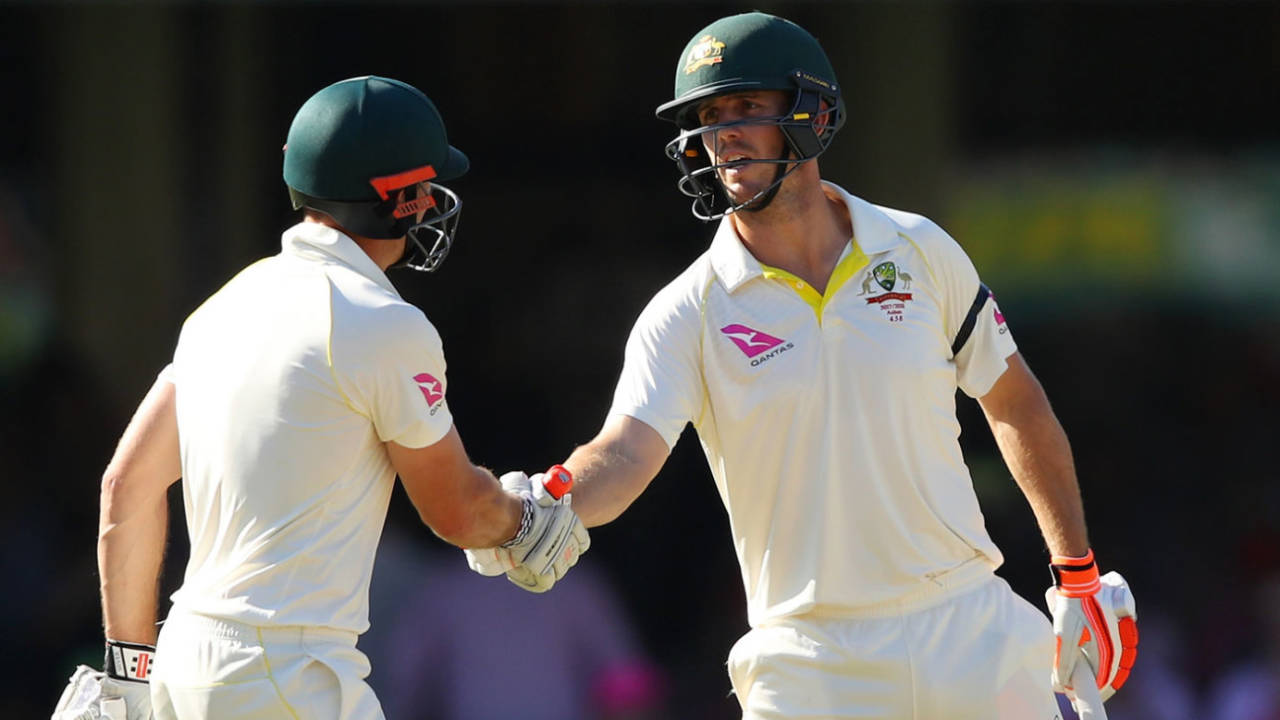 Mitchell Marsh gets a handshake from his brother on reaching fifty&nbsp;&nbsp;&bull;&nbsp;&nbsp;Getty Images