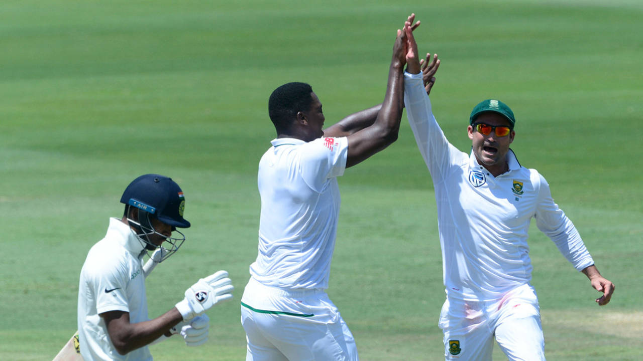 Lungi Ngidi and Dean Elgar celebrate the wicket of Hardik Pandya, South Africa v India, second Test, Centurion, day five, January 17, 2018