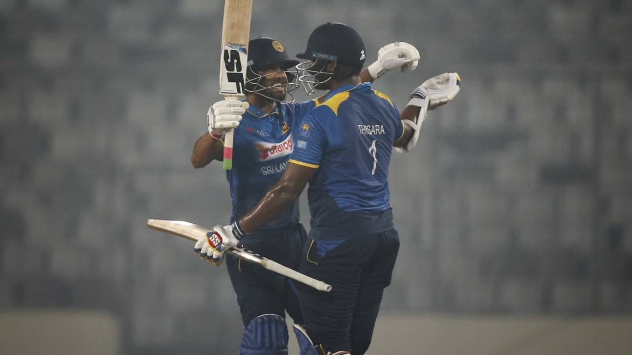 Dinesh Chandimal celebrates Sri Lanka's win with Thisara Perera&nbsp;&nbsp;&bull;&nbsp;&nbsp;Associated Press