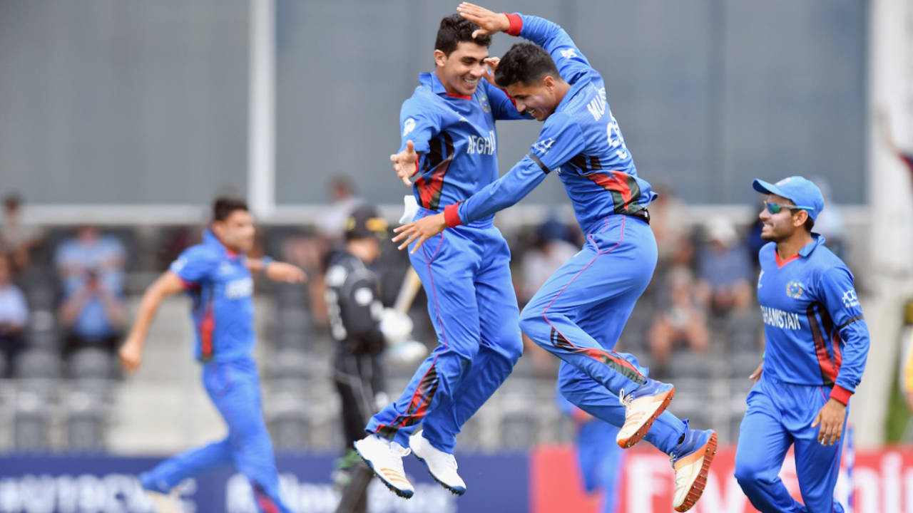 Mujeeb Zadran (right) is thrilled after taking a wicket&nbsp;&nbsp;&bull;&nbsp;&nbsp;ICC/Getty Images