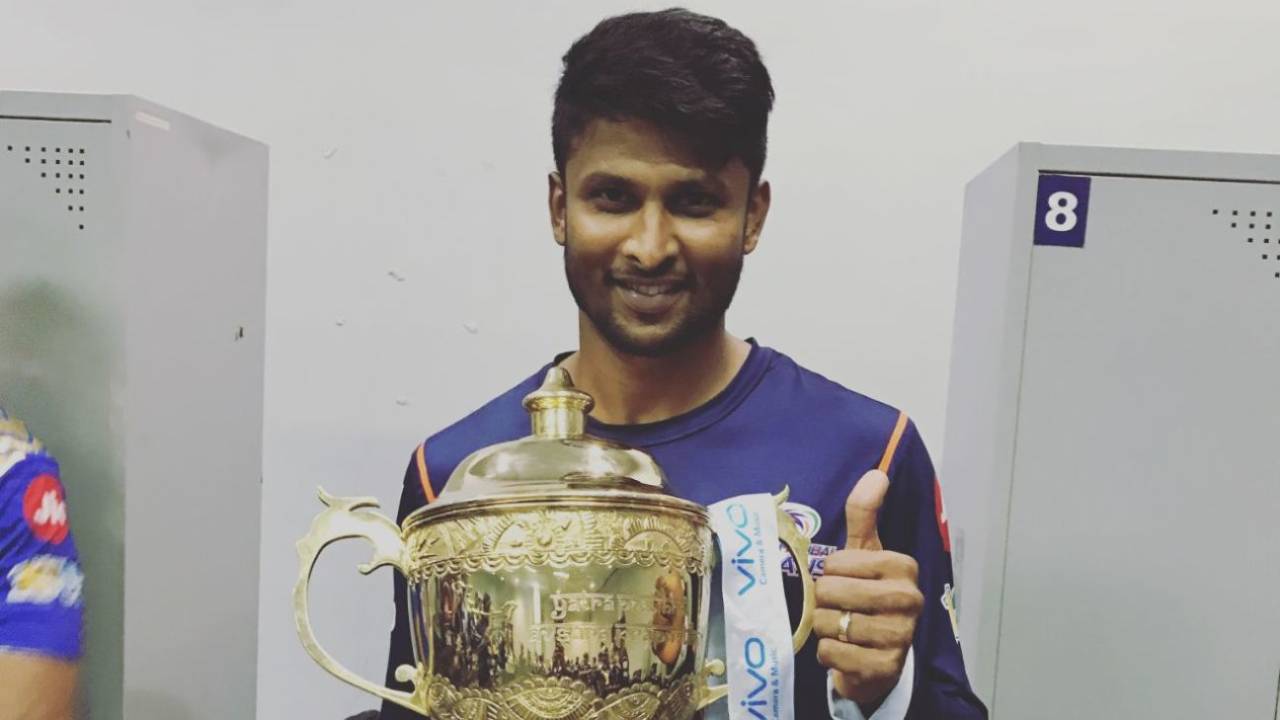 K Gowtham with the IPL trophy