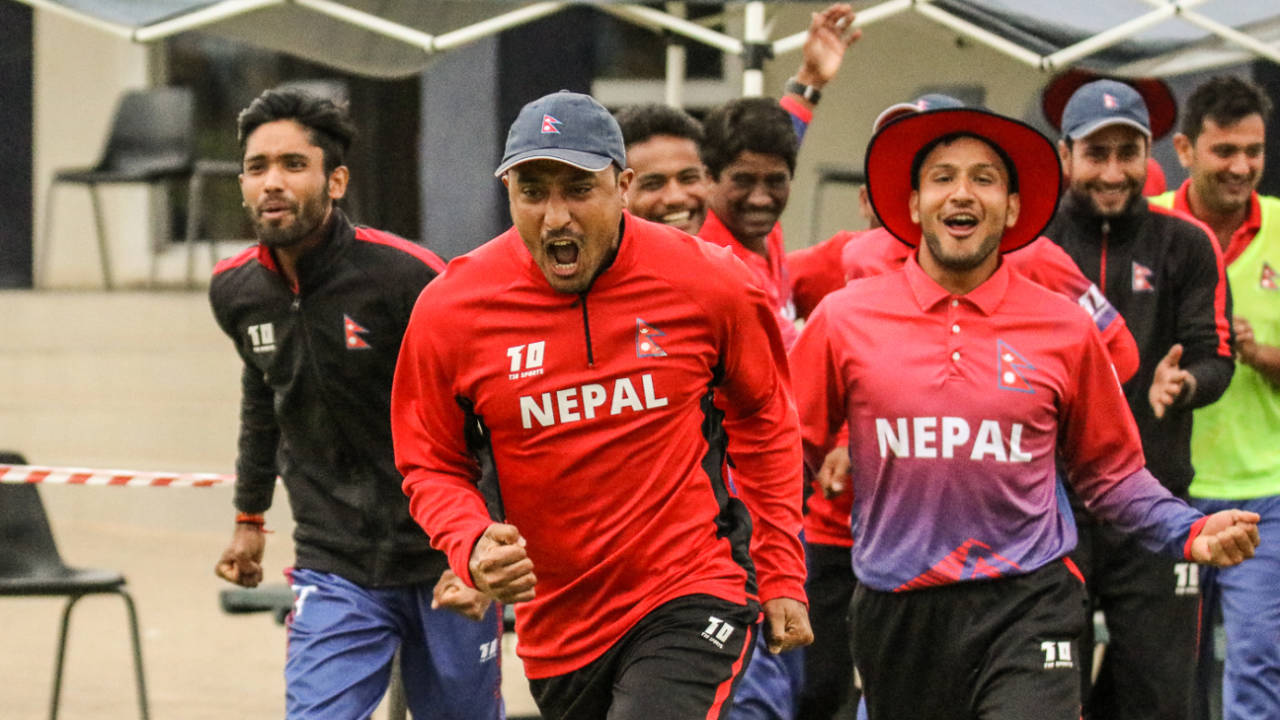 Captain Paras Khadka leads the celebratory charge after Nepal clinched a dramatic win, Namibia v Nepal, ICC World Cricket League Division Two, Windhoek, February 8, 2018
