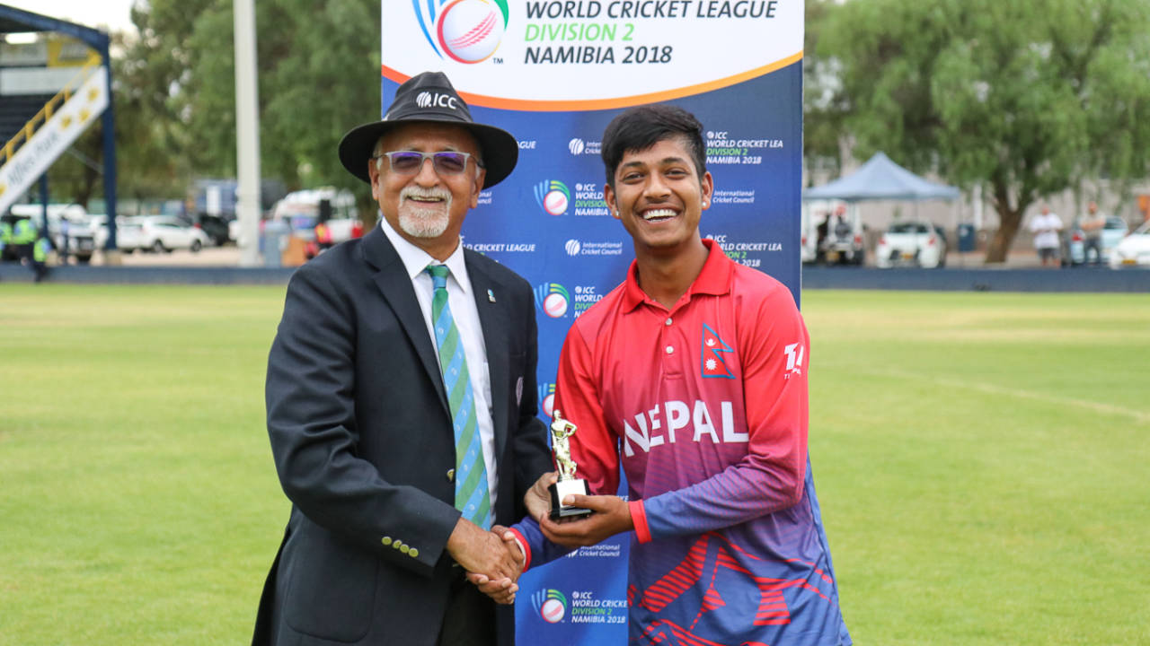 Sandeep Lamichhane receives his Man of the Match award from ICC match referee Dev Govindjee&nbsp;&nbsp;&bull;&nbsp;&nbsp;Peter Della Penna