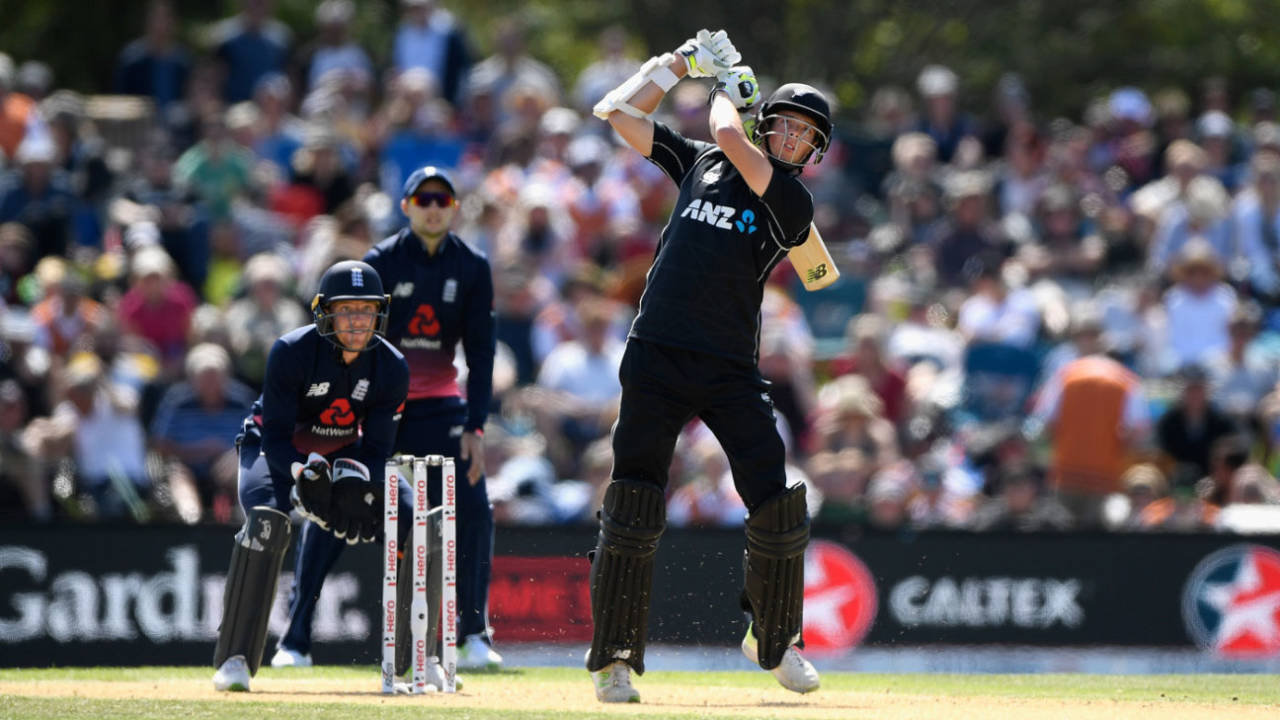 Mitchell Santner steps out to hit down the ground, New Zealand v England, 5th ODI, Christchurch, March 10, 2018