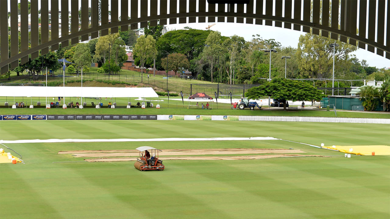 A member of the ground staff works on the Allan Border Field outfield, Queensland v Tasmania, Sheffield Shield 2017-18, final, Brisbane, 1st day, March 23, 2018