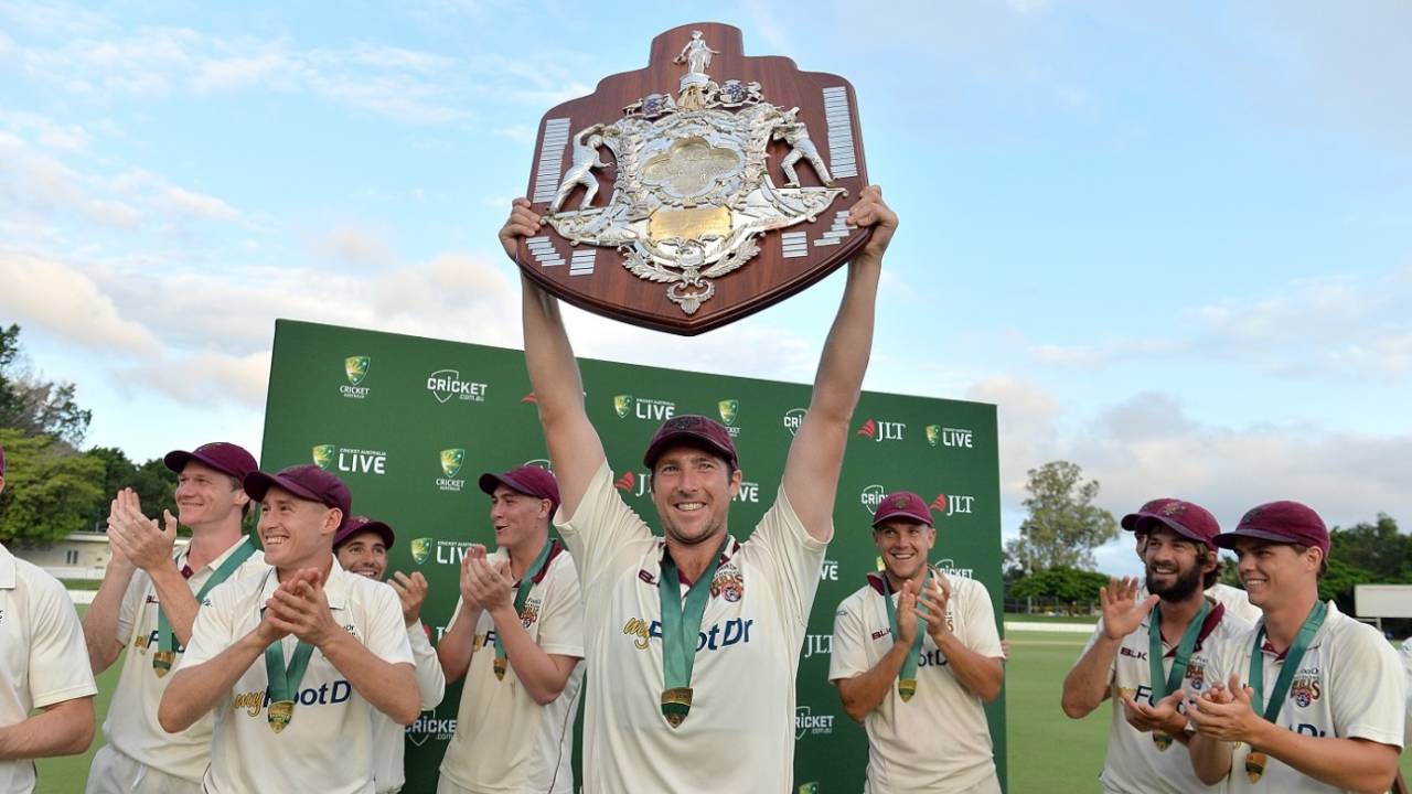 Luke Feldman holds the Sheffield Shield aloft, Queensland v Tasmania, Sheffield Shield 2017-18 final, Brisbane, March 27, 2018