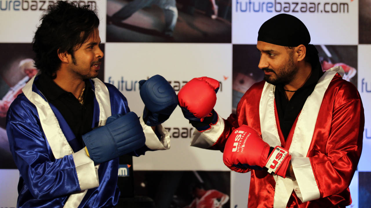 Sreesanth and Harbhajan Singh pose with boxing gloves at a promotional event in Mumbai, October 25, 2010