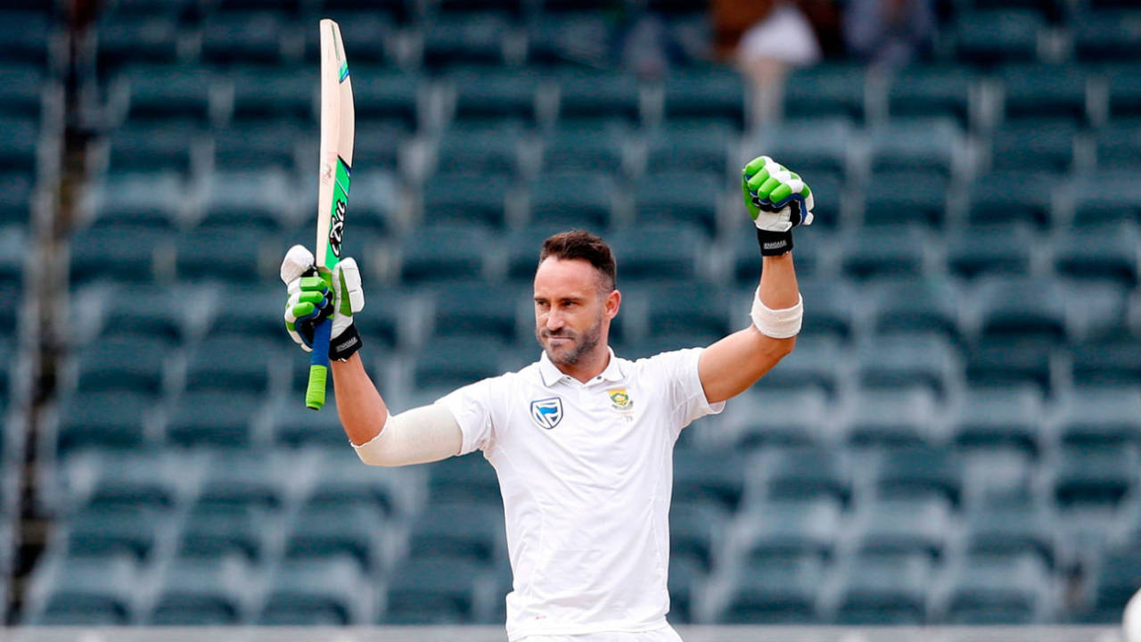 Faf du Plessis raises his arms to celebrate his century&nbsp;&nbsp;&bull;&nbsp;&nbsp;AFP