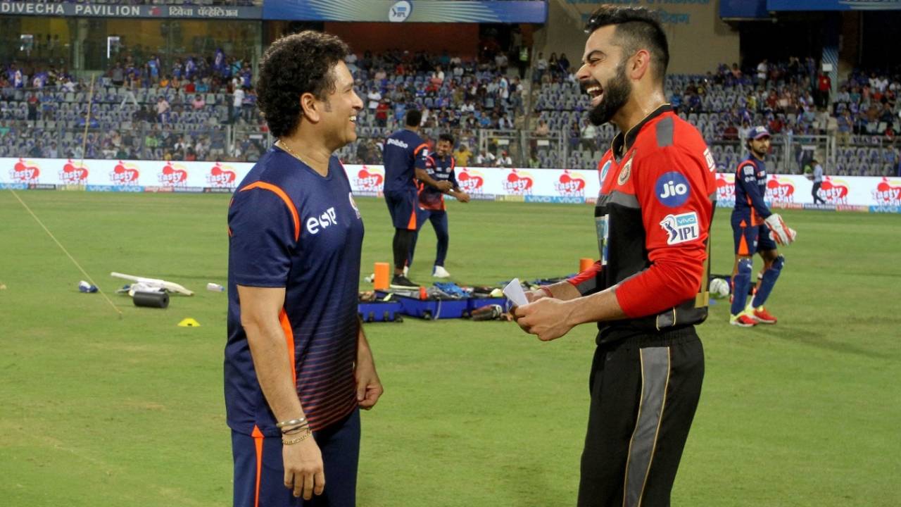 Sachin Tendulkar and Virat Kohli share a light moment, Mumbai Indians v Royal Challengers Bangalore, IPL 2018, Mumbai, April 17, 2018