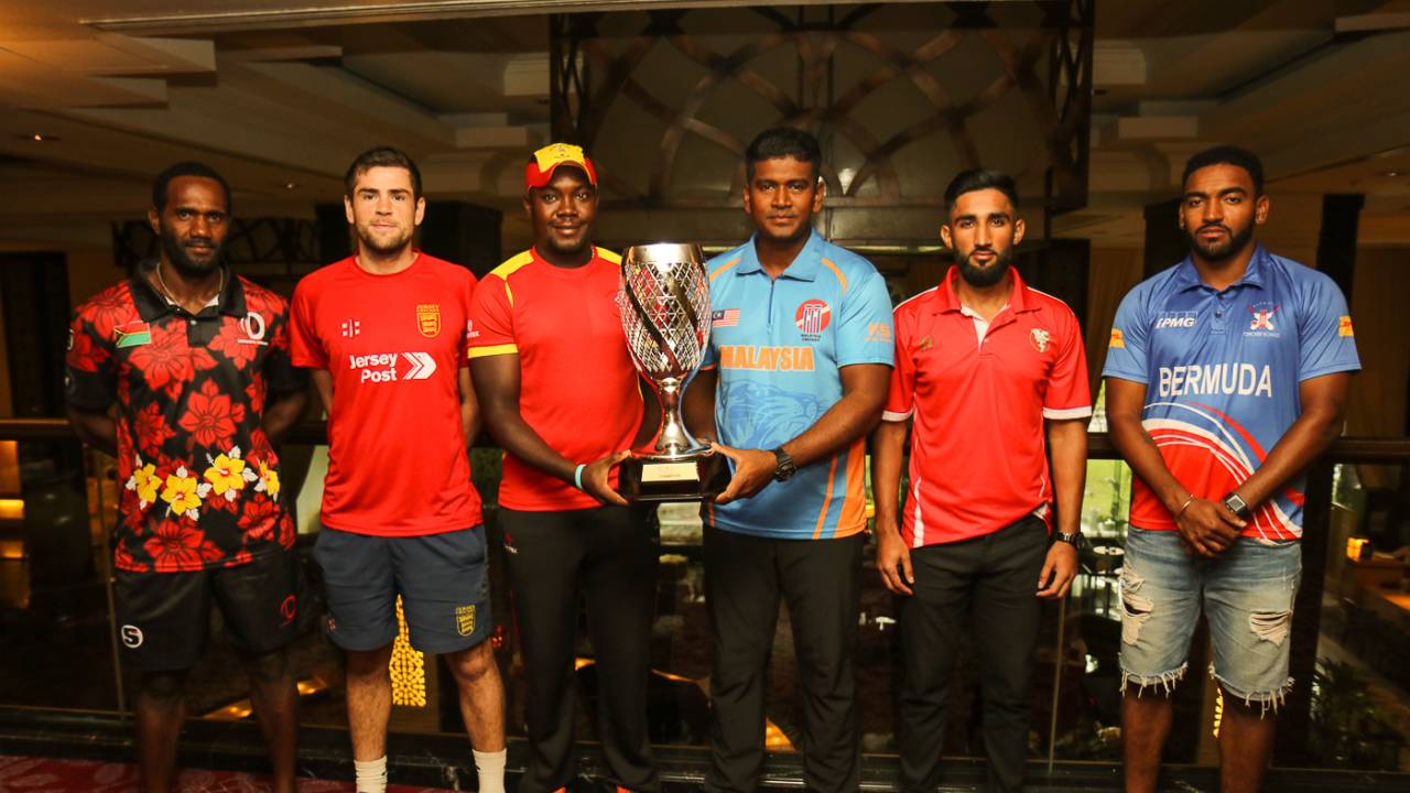 The six captains pose with the WCL Division Four tournament trophy, Kuala Lumpur