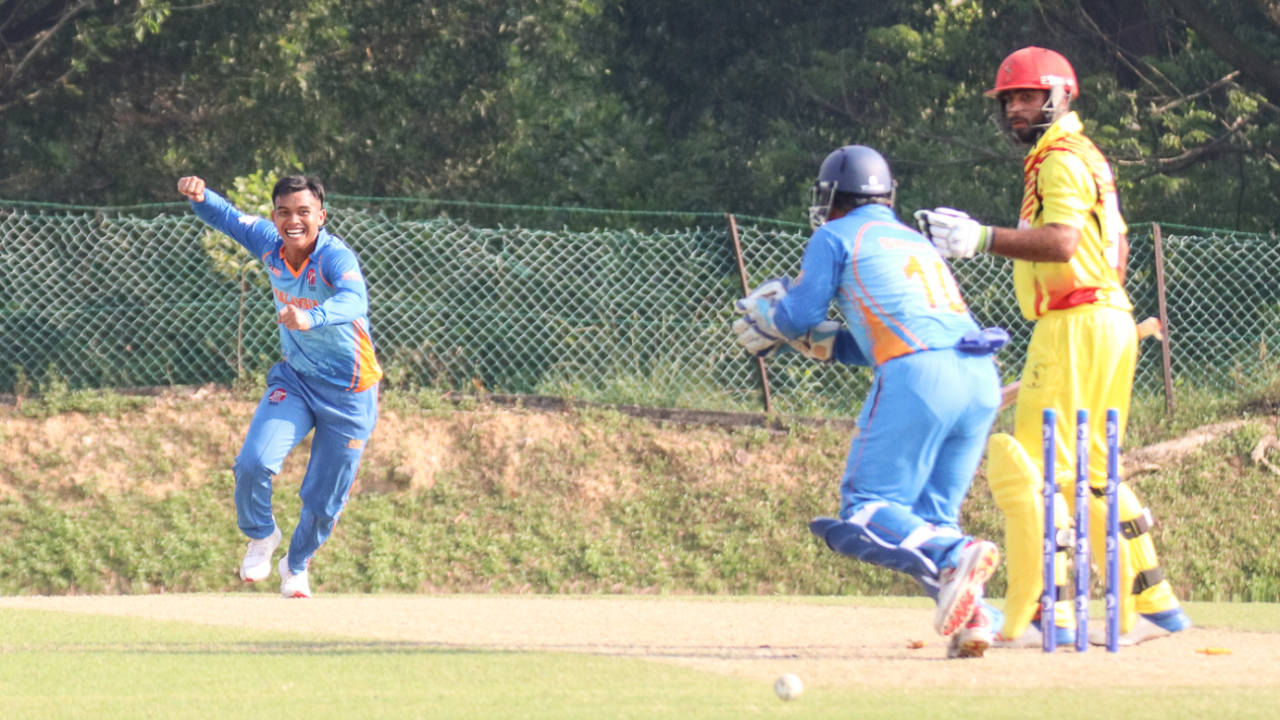 Muhammad Syahadat celebrates after bowling Bilal Hassan for his fourth wicket, Malaysia v Uganda, ICC World Cricket League Division Four, Kuala Lumpur, April 29, 2018