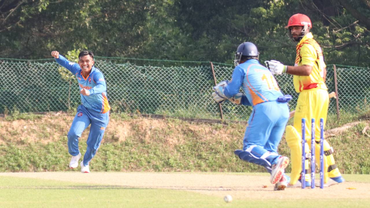 Muhammad Syahadat celebrates after bowling Bilal Hassan for his fourth wicket
