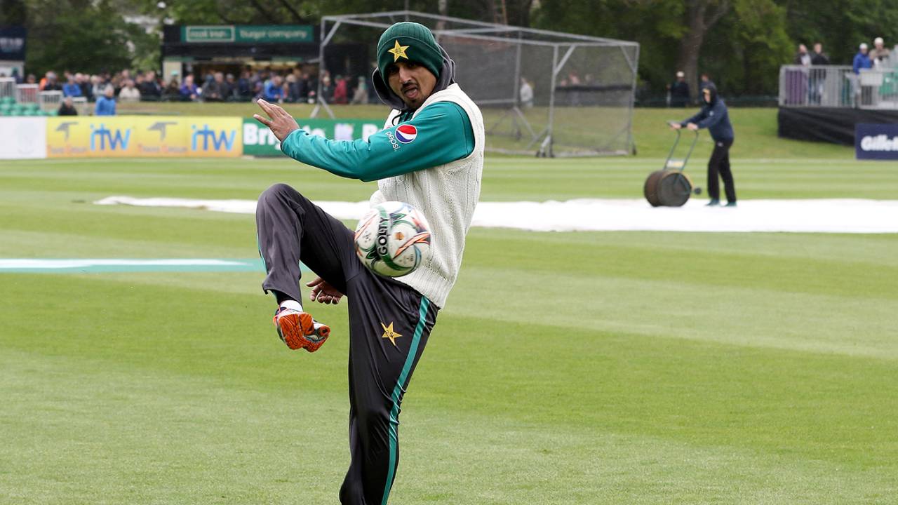 Saad Ali kicks a football around with his team-mates during a rain delay, Ireland v Pakistan, Only Test, Malahide, 1st day, May 11, 2018