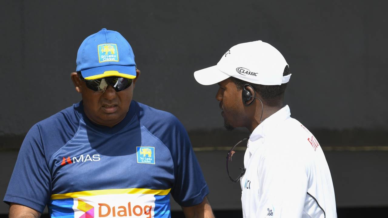 Sri Lanka team manager Asanka Gurusinha speaks with a match official