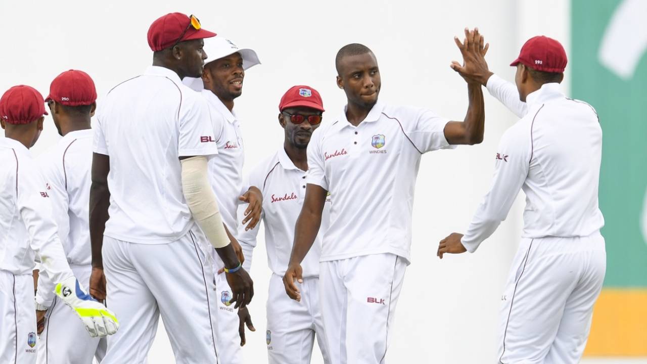 Miguel Cummins is mobbed by his team-mates, West Indies v Bangladesh, 1st Test, North Sound, 1st day, July 4, 2018