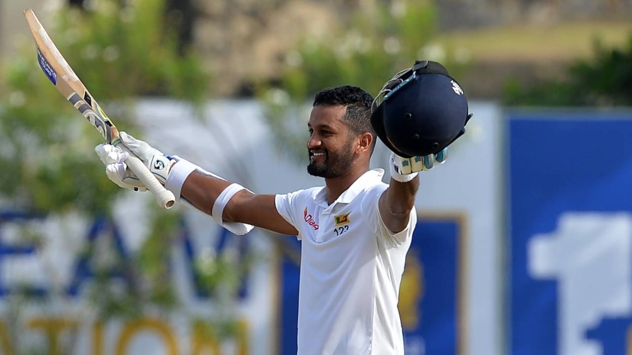 Dimuth Karunaratne raises his bat after reaching a century, Sri Lanka v South Africa, 1st Test, Galle, 1st day, July 12, 2018