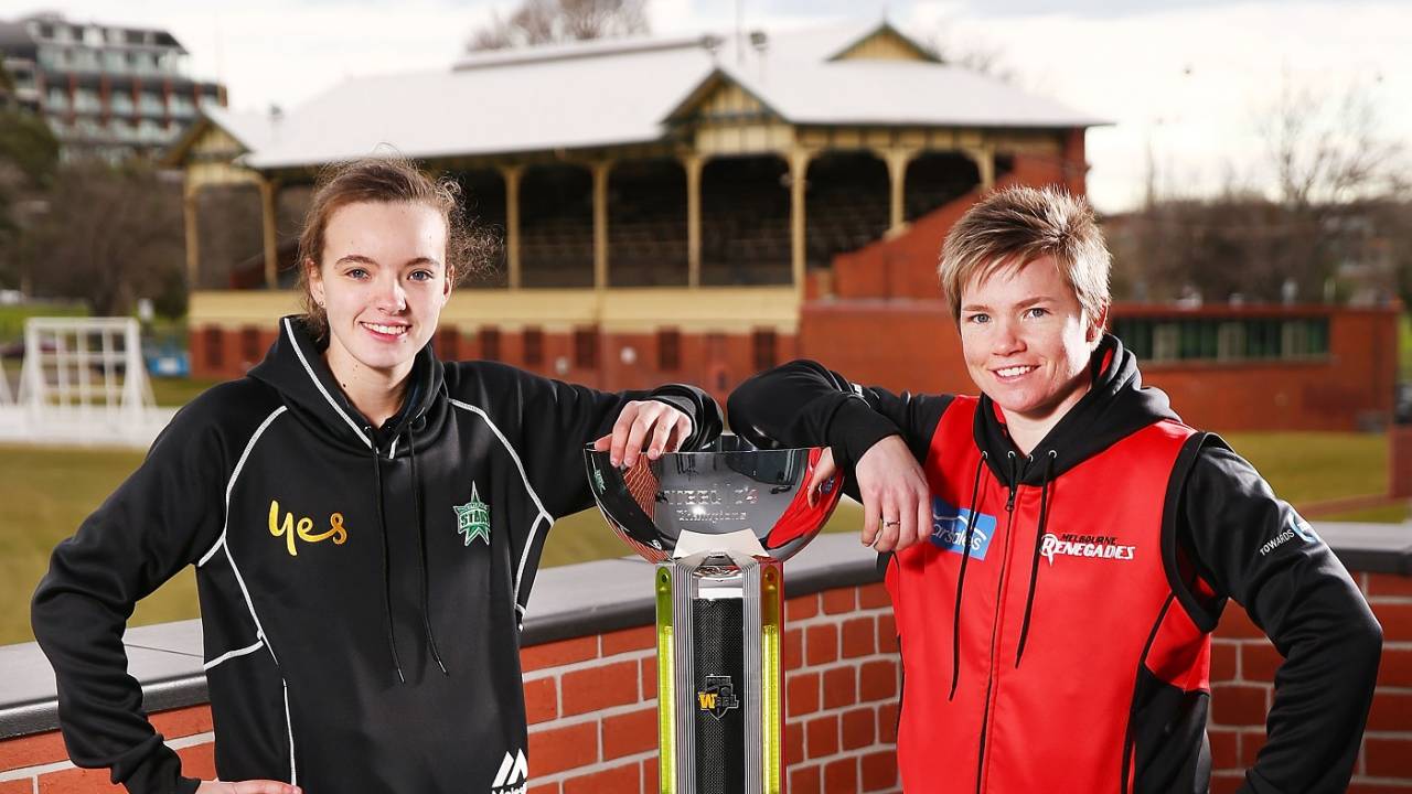 Makinley Blows and Jess Cameron pose with the WBBL trophy