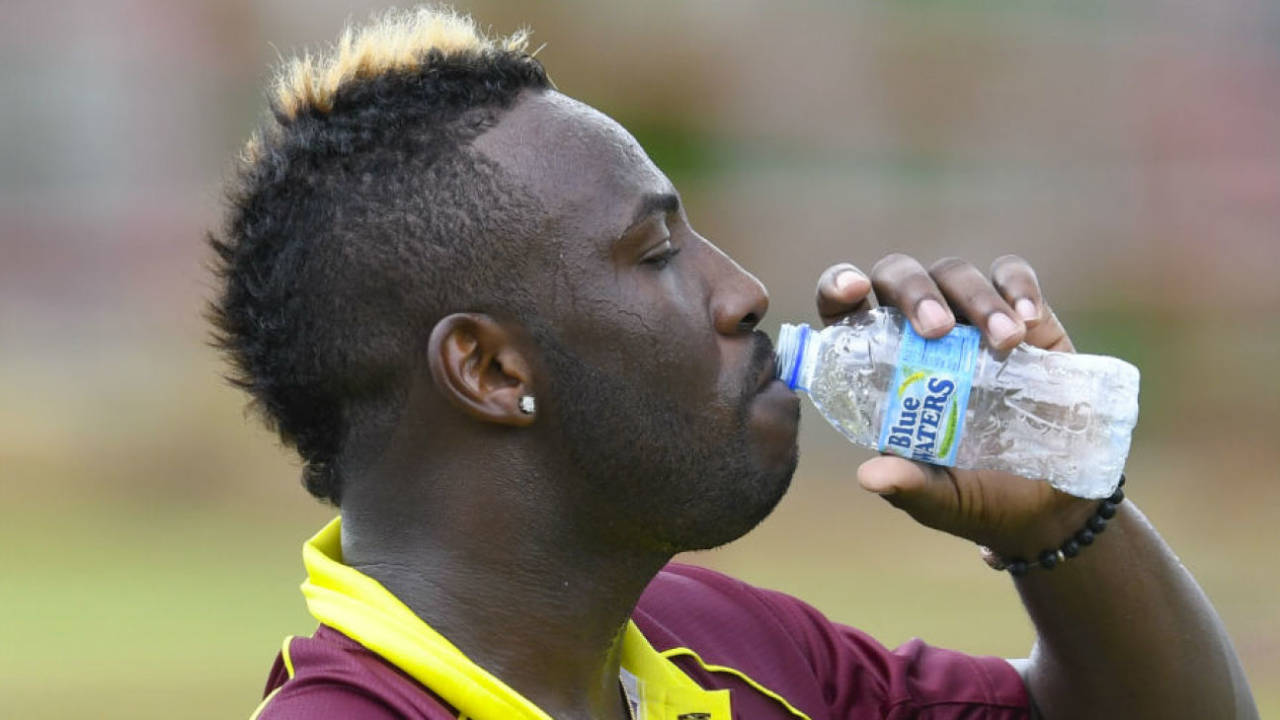 Andre Russell guzzles down water on a humid day&nbsp;&nbsp;&bull;&nbsp;&nbsp;CWI