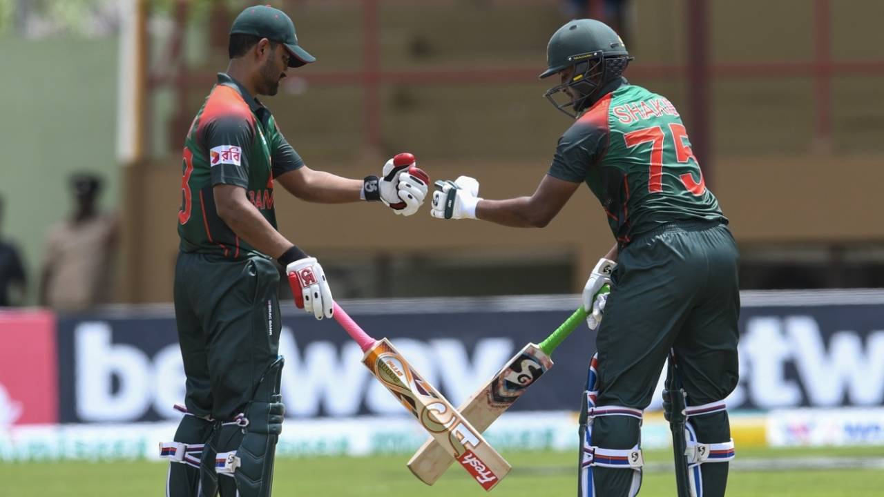 Tamim Iqbal and Shakib Al Hasan punch gloves during their 207-run partnership, West Indies v Bangladesh, 1st ODI, Guyana, July 22, 2018