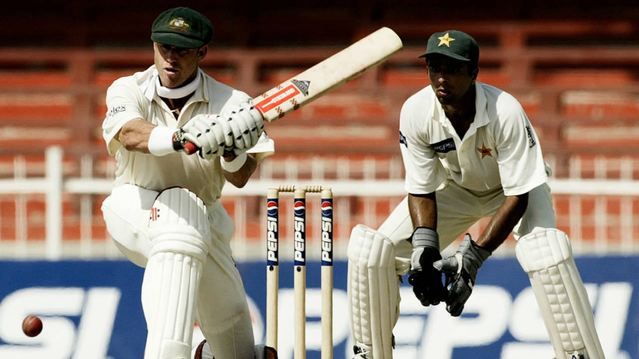 Matthew Hayden looks to sweep, Australia v Pakistan, 2nd Test, Sharjah, 2nd day, October 12, 2002