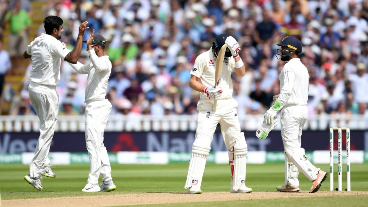 The Indians celebrate while Joe Root holds his head in agony&nbsp;&nbsp;&bull;&nbsp;&nbsp;Getty Images
