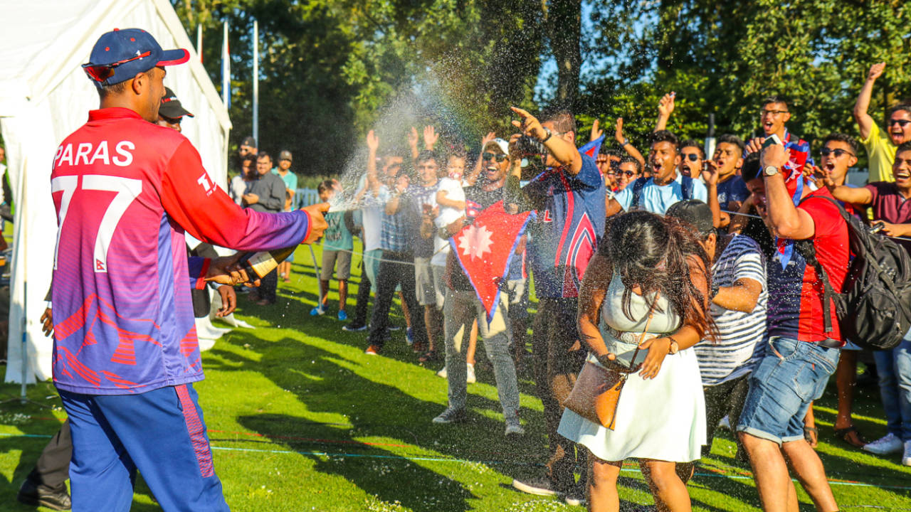 Paras Khadka gives the traveling Nepal fans a champagne shower to celebrate a famous win, Netherlands v Nepal, 2nd ODI, Amstelveen, August 3, 2018
