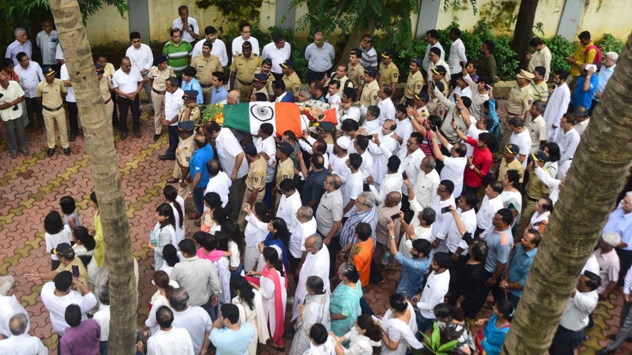 Relatives and friends carry the body of Ajit Wadekar to a crematorium in Mumbai, August 17, 2018