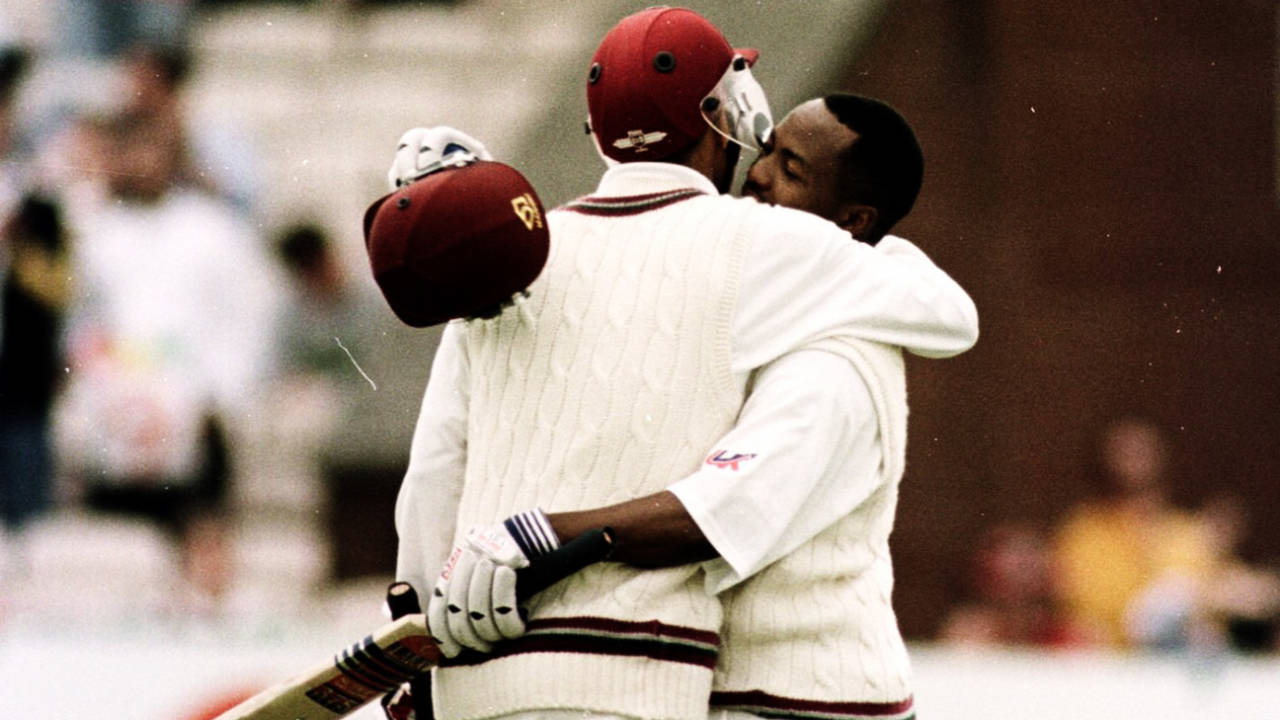 Brian Lara is congratulated on reaching his hundred by Jimmy Adams, England v West Indies, Old Trafford, August 6, 2000
