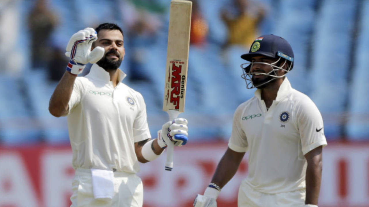 Virat Kohli soaks in the applause after bringing up his 24th Test ton even as Rishabh Pant watches, India v West Indies, 1st Test, Rajkot, 2nd day, October 5, 2018