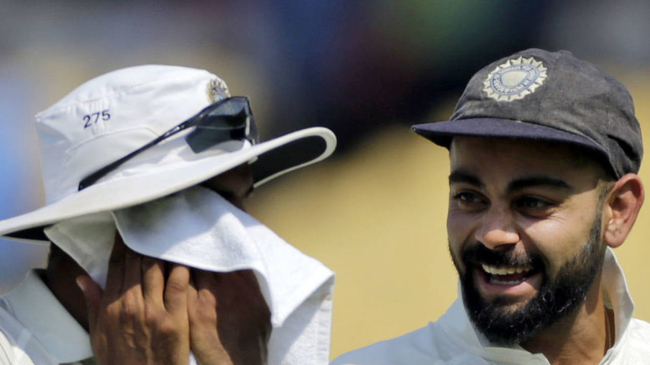 Virat Kohli and Ravindra Jadeja laugh as they walk off after India's win, India v West Indies, 1st Test, Rajkot, 3rd day, October , 2018