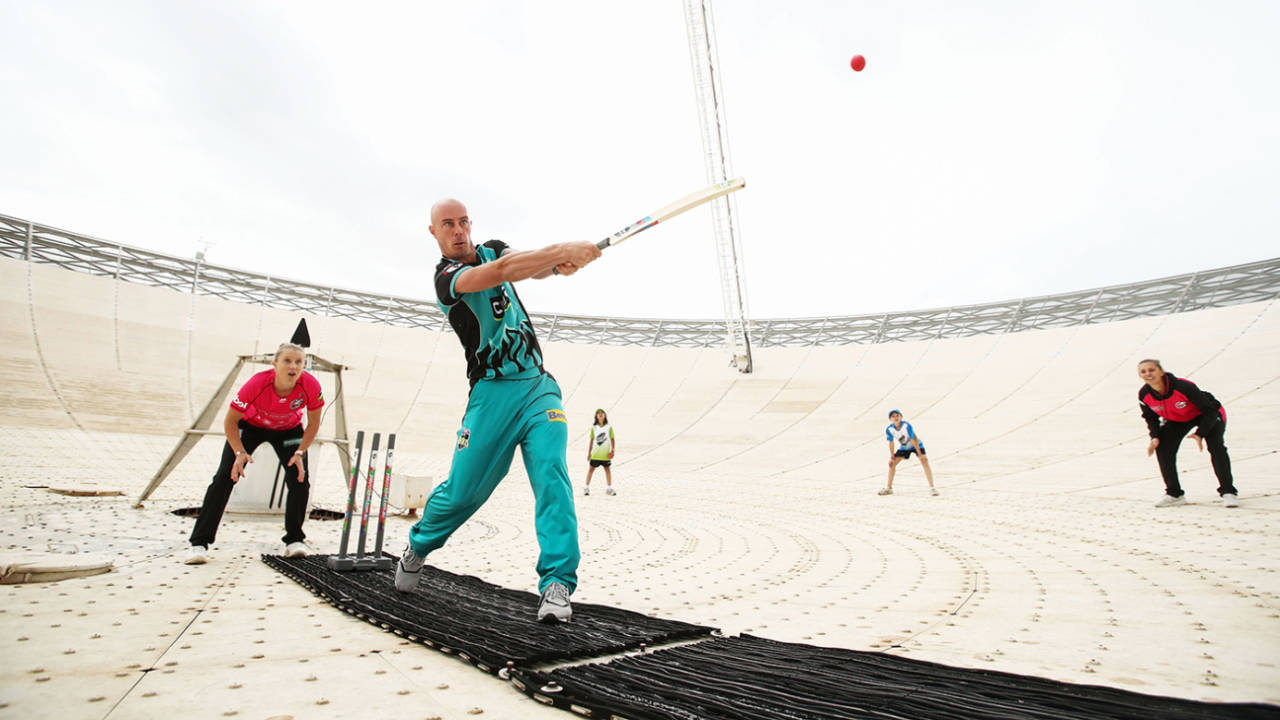 Chris Lynn hits out on the radio telescope in Parkes, NSW, re-enacting a scene from the movie <i>The Dish</i>, which told the story of how the telescope transmitted the first TV pictures from the 1969 Apollo 11 moon landing, Australia, October 11, 2019