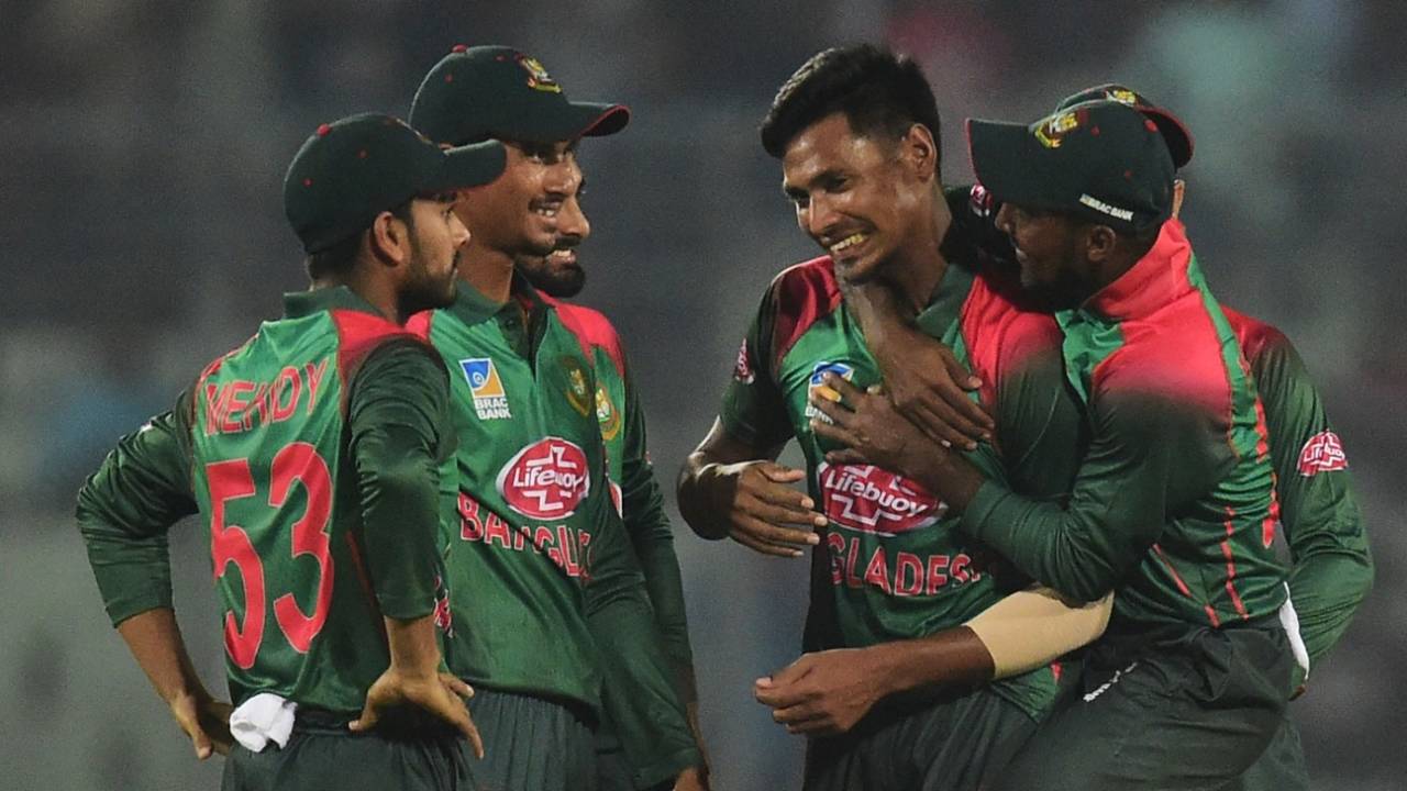 Mustafizur Rahman is congratulated by his team-mates, Bangladesh v Zimbabwe, 1st ODI, Mirpur, October 21, 2018